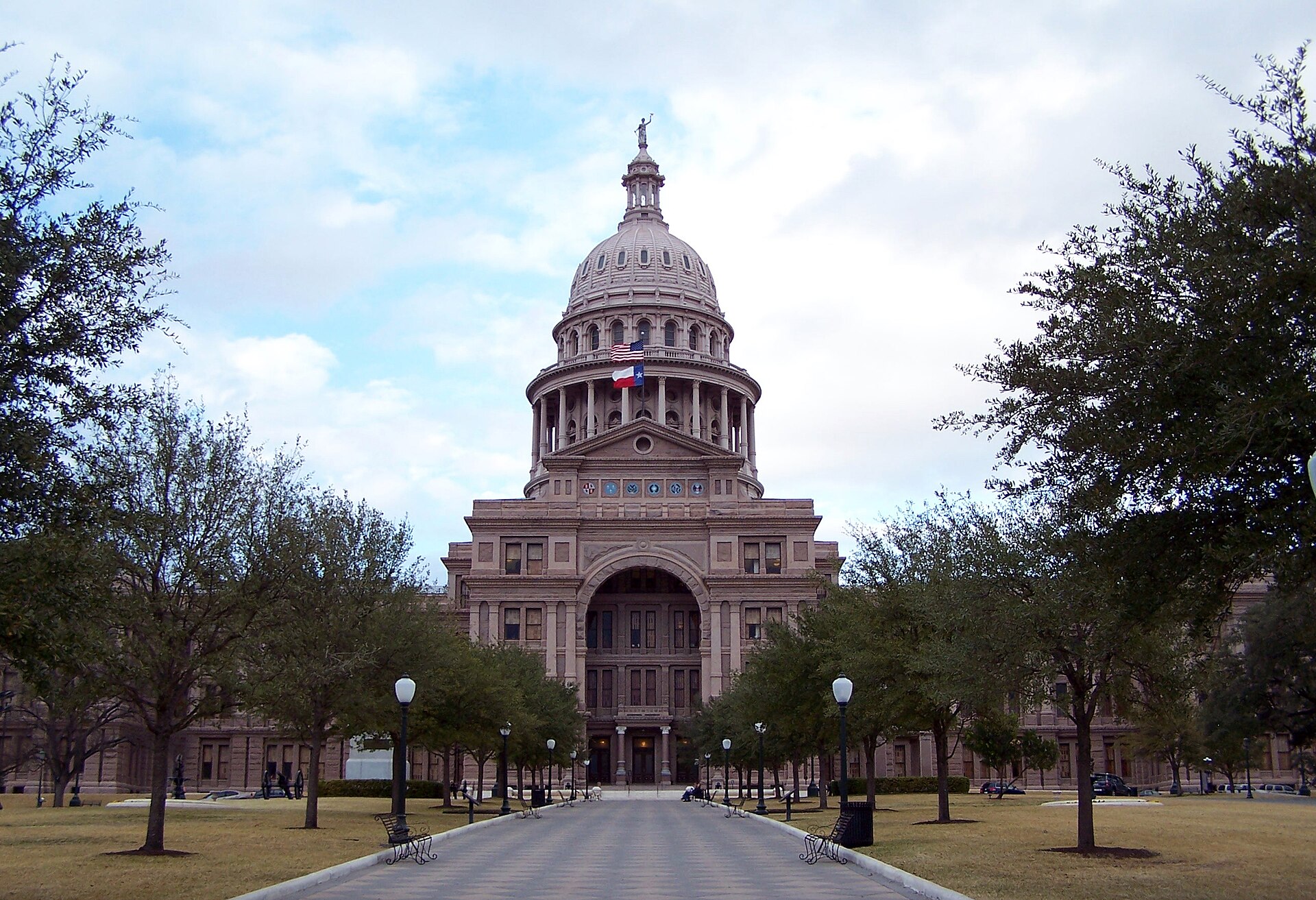 The Texas State Capitol in Austin seen down its tree-lined front walk