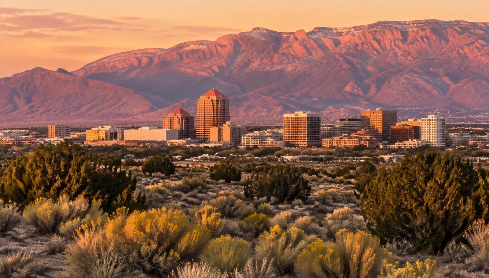 Albuquerque, New Mexico downtown skyline at sunset with the Sandia Mountains - VA nexus letters for local veterans