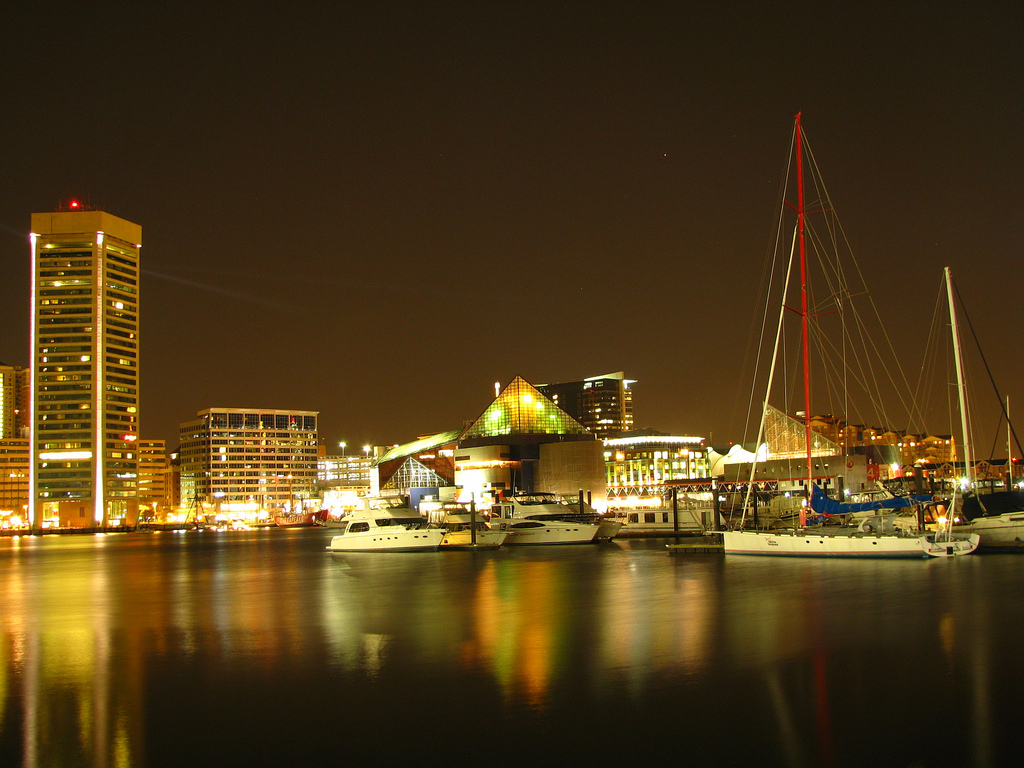 Sailboats and the waterfront promenade at Baltimore's Inner Harbor in Maryland