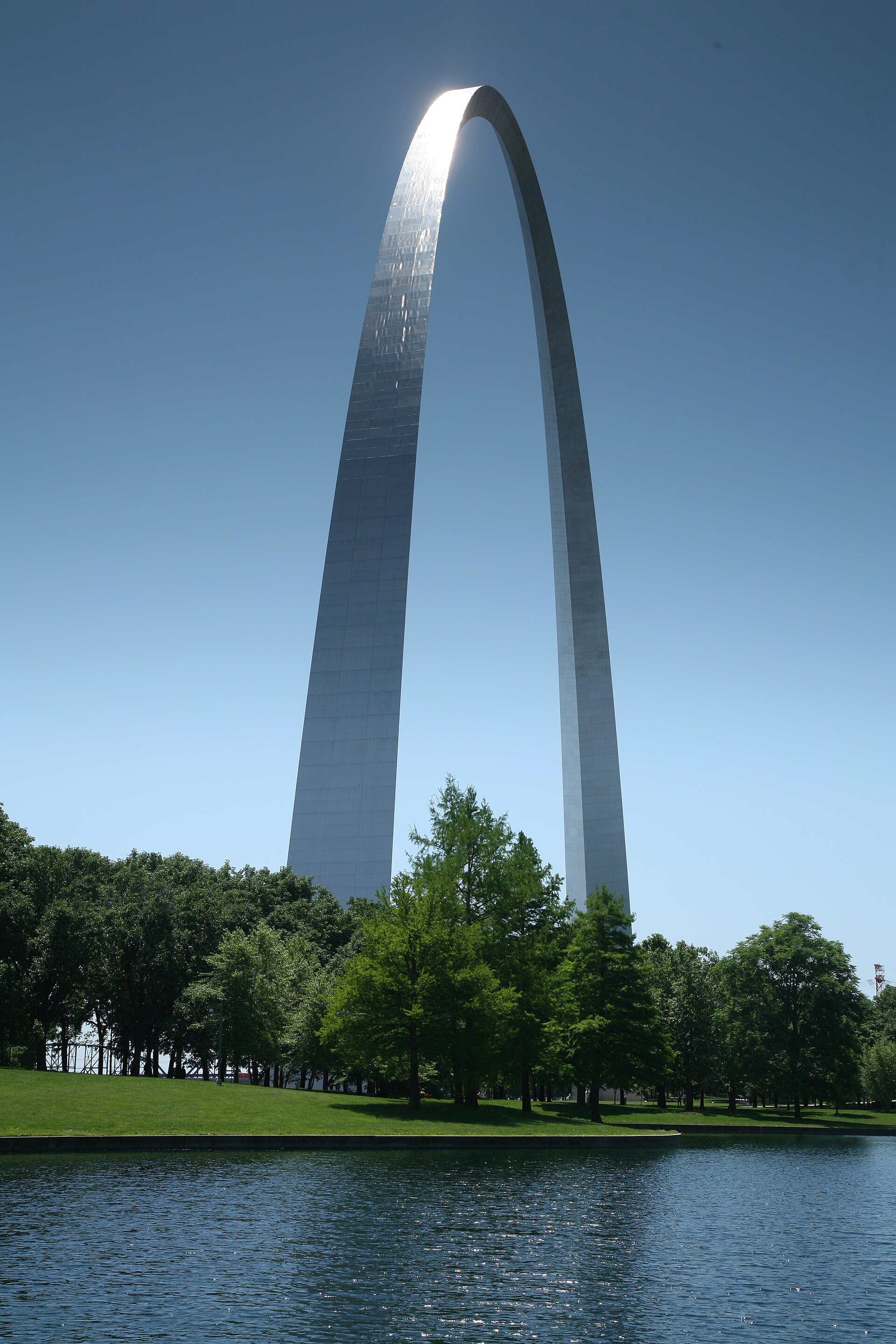 The Gateway Arch reflected along the Mississippi River waterfront in St. Louis, Missouri