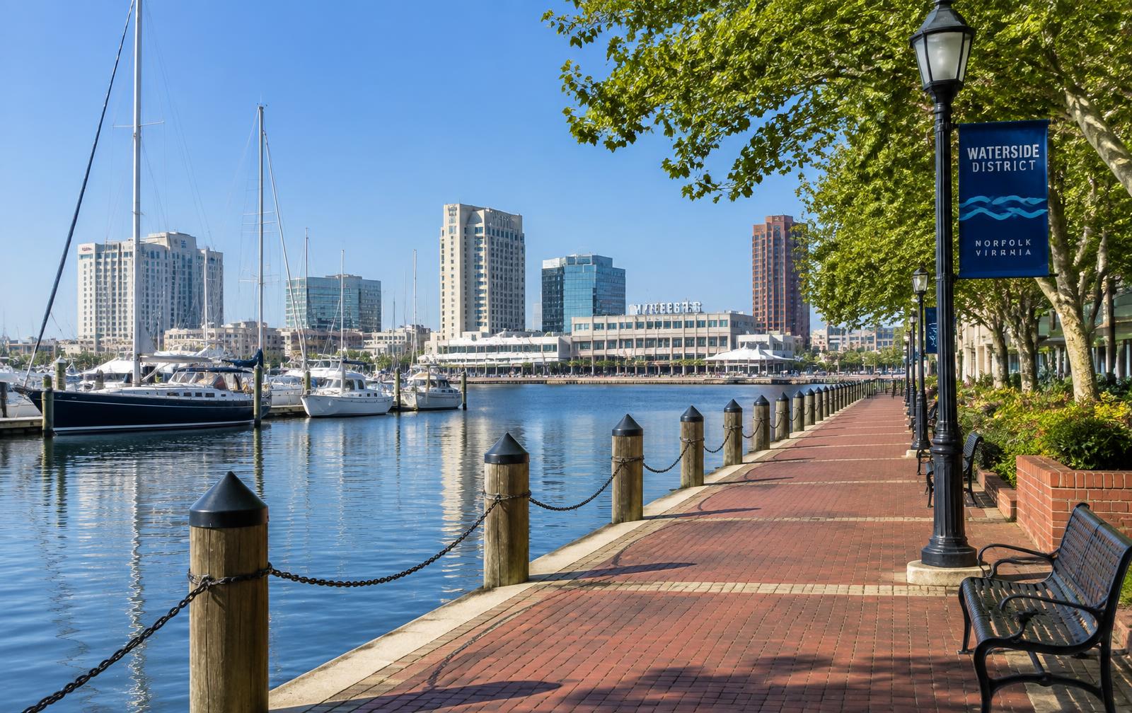 Waterside District harbor promenade and sailboats in Norfolk, Virginia on a bright morning