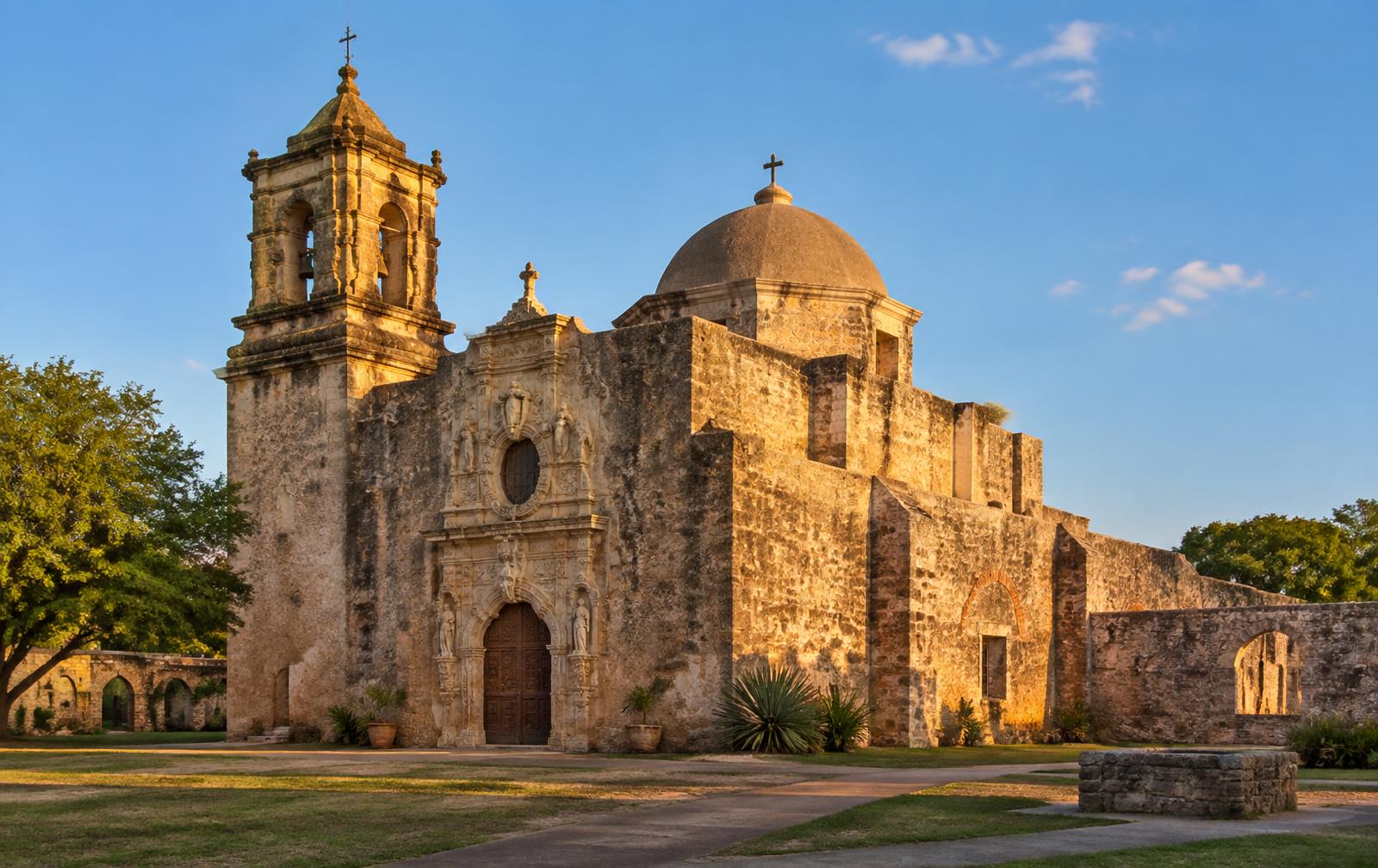 Mission San Jose stone church and grounds in San Antonio, Texas at golden hour
