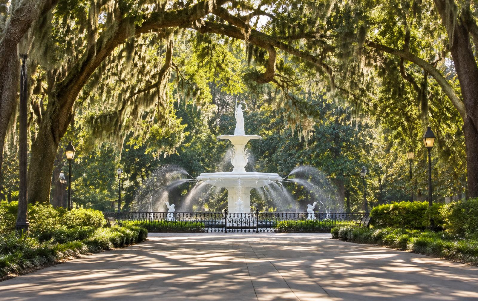 Forsyth Park fountain and live oak trees draped in Spanish moss in Savannah, Georgia in morning light